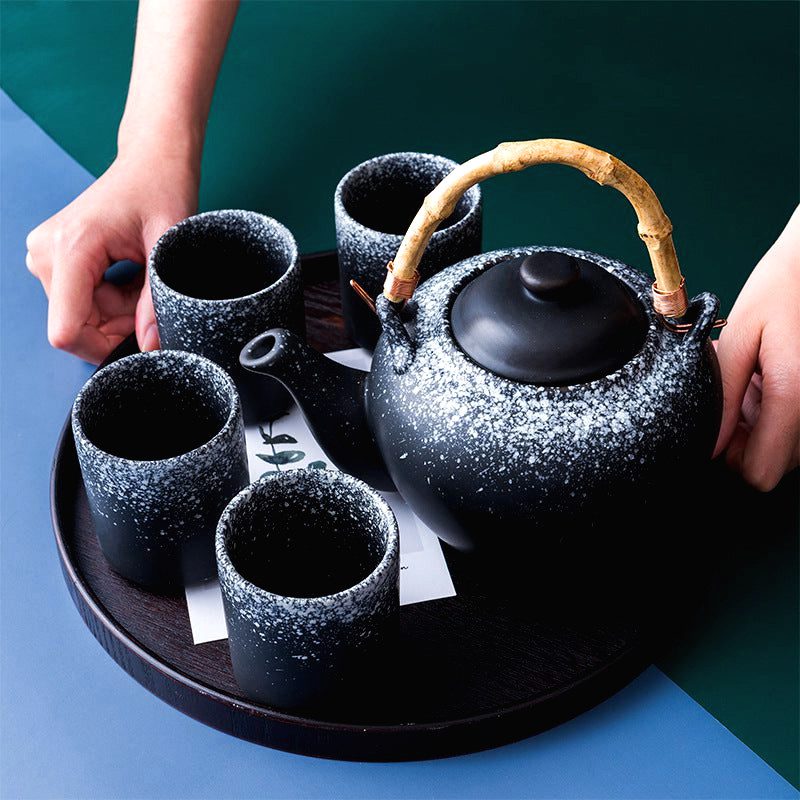 Théière japonaise Tamashiro grise et quatre tasses sur un plateau rond