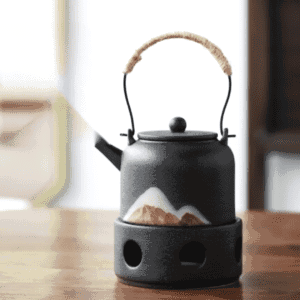 Théière japonaise Montagne noire à motif de montagne sur son réchaud