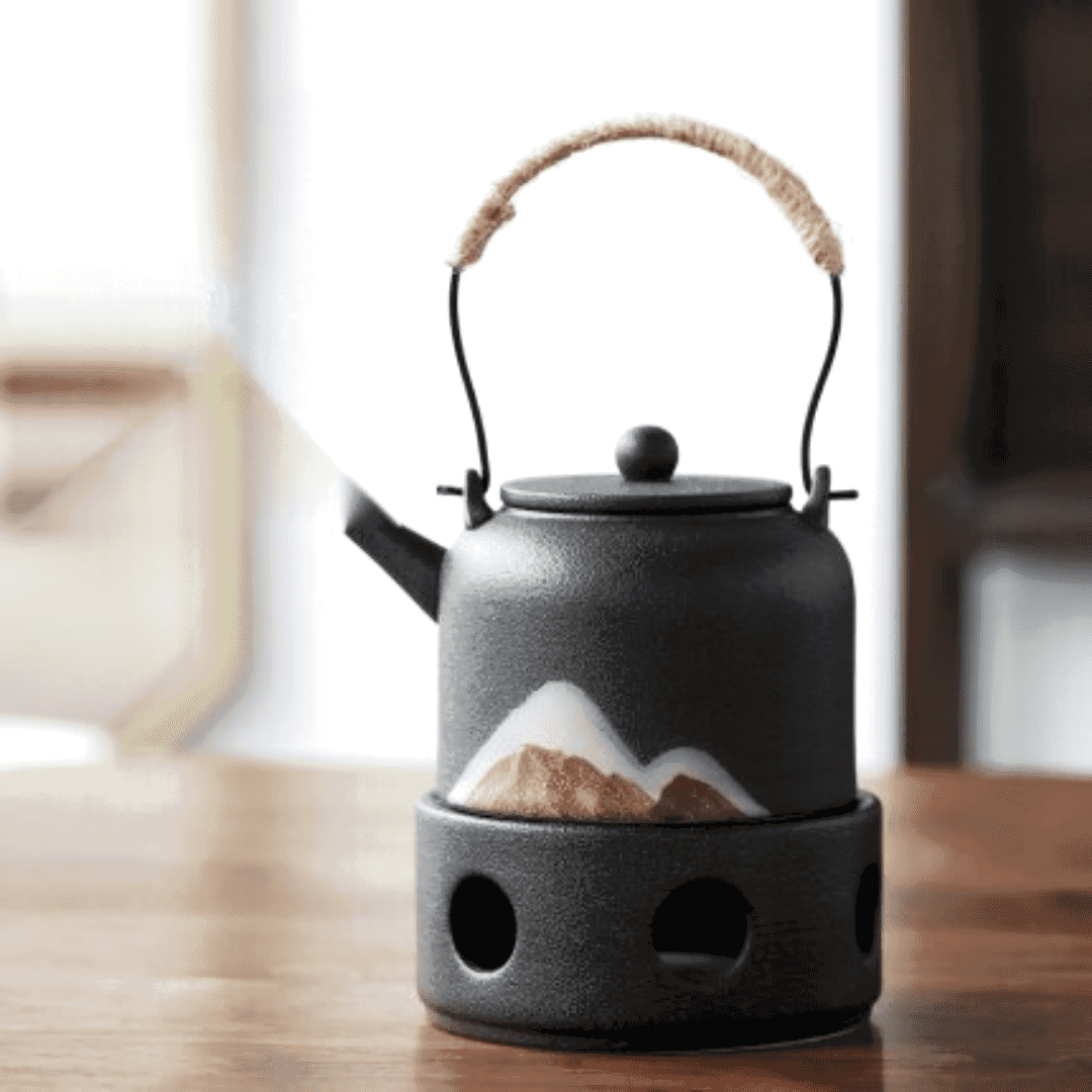 Théière japonaise Montagne noire à motif de montagne sur son réchaud