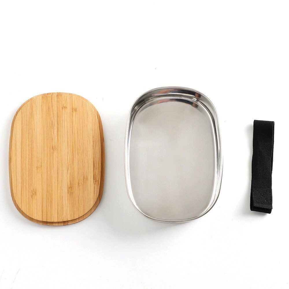 Bento ovale en inox ouvert, couvercle en bambou et sangle noire à côté
