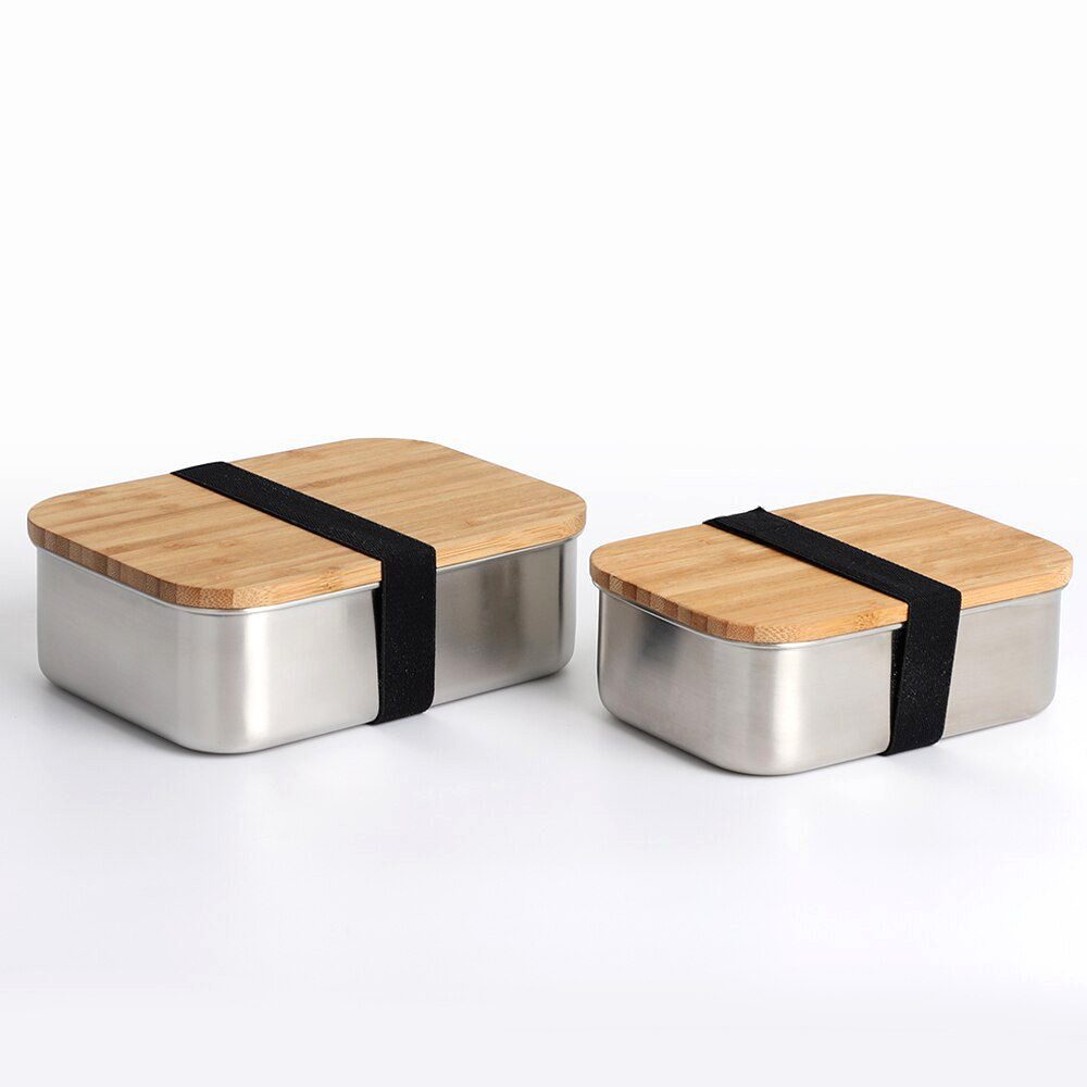 Deux bentos en inox et bambou côte à côte avec leurs sangles noires
